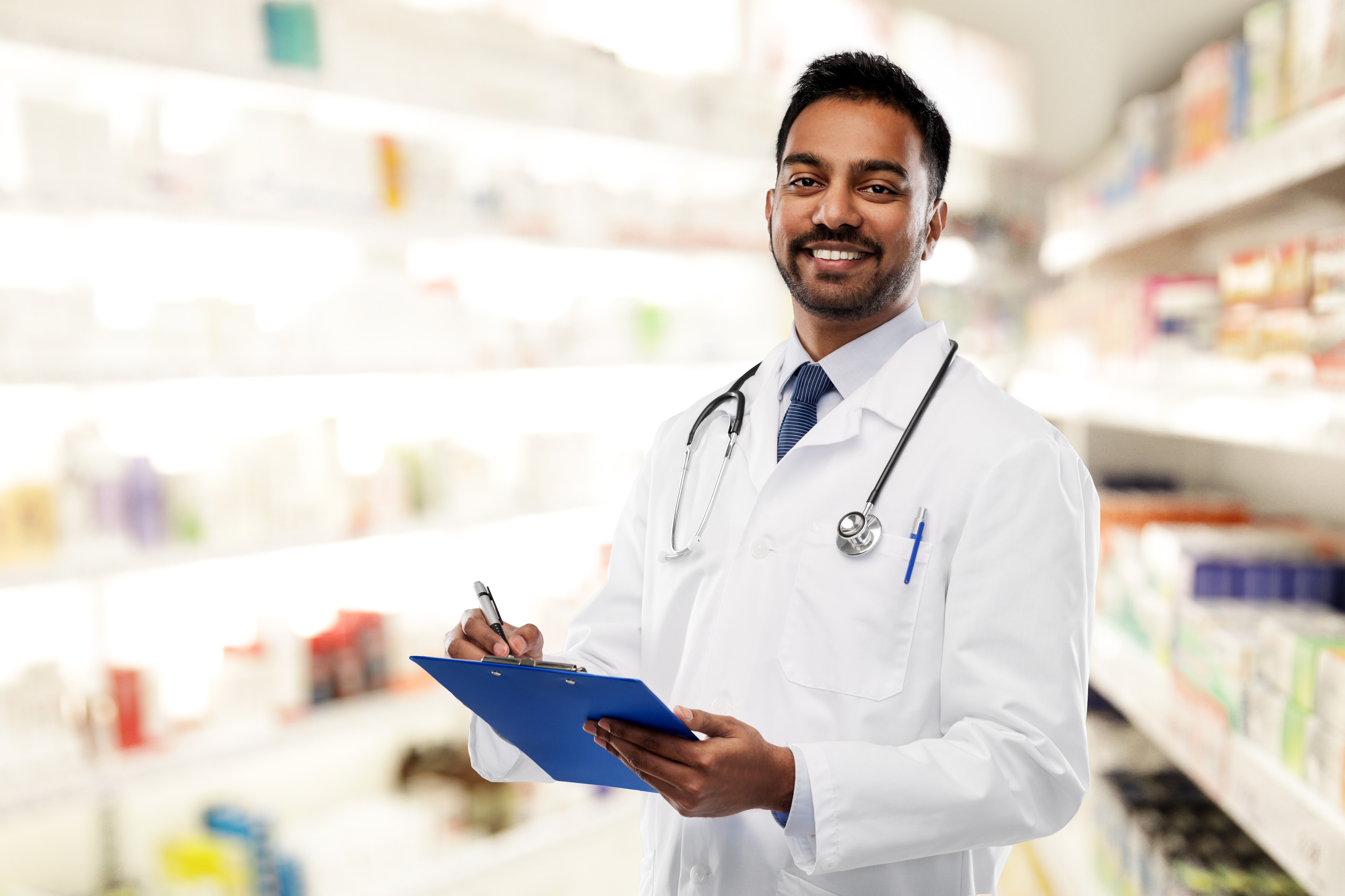 male pharmacist in a white coat